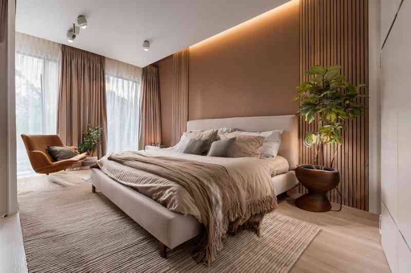 mocha mousse bedroom with brown bed and chic interior